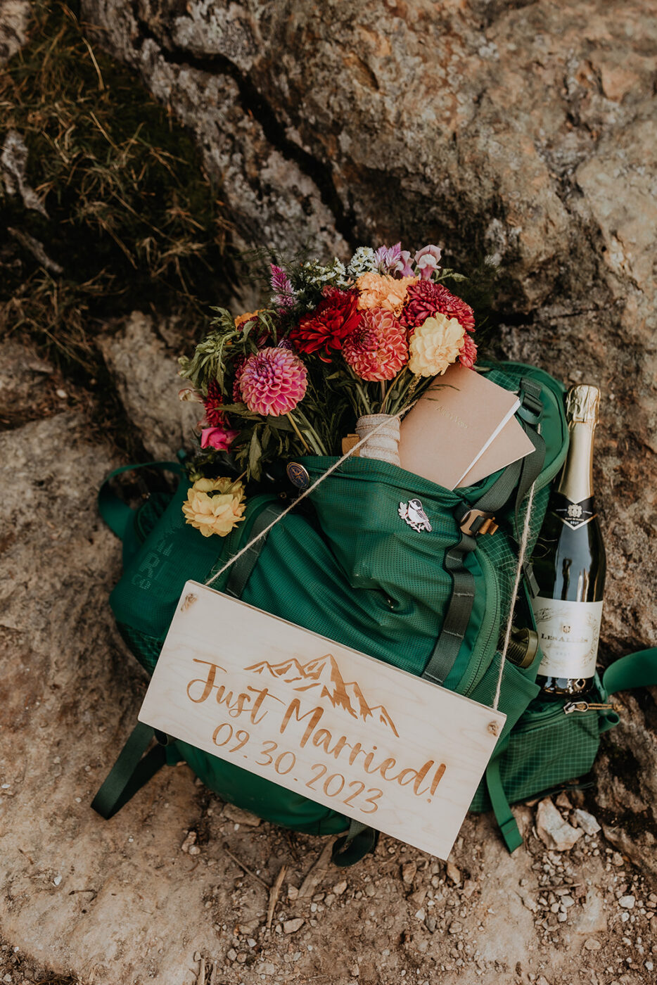 just married sign on hiking backpack